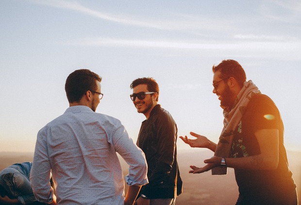 Three men talking