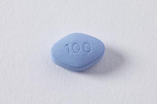 A blue diamond pill on a white background